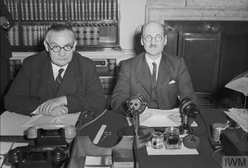 1936-1945 (H 42138) The Attlee Administration 1945 - 1951: Prime Minister Clement Attlee (right) and Foreign Secretary Ernest Bevin photographed at 10 Downing Street at midnight on 14 August 1945. 